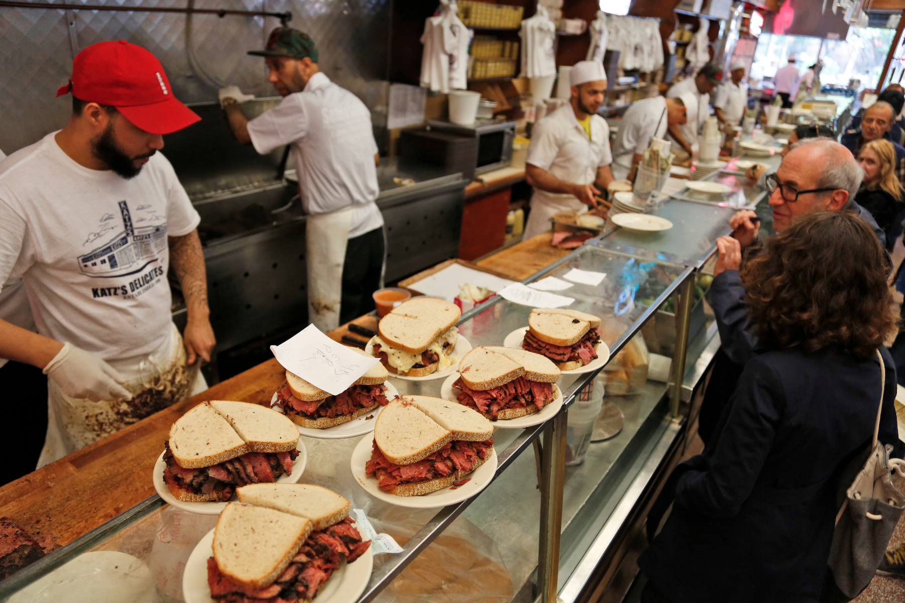 Katz's Deli's famous sandwiches attract hometown New Yorkers and tourists alike on the Lower East Side / Associated Press