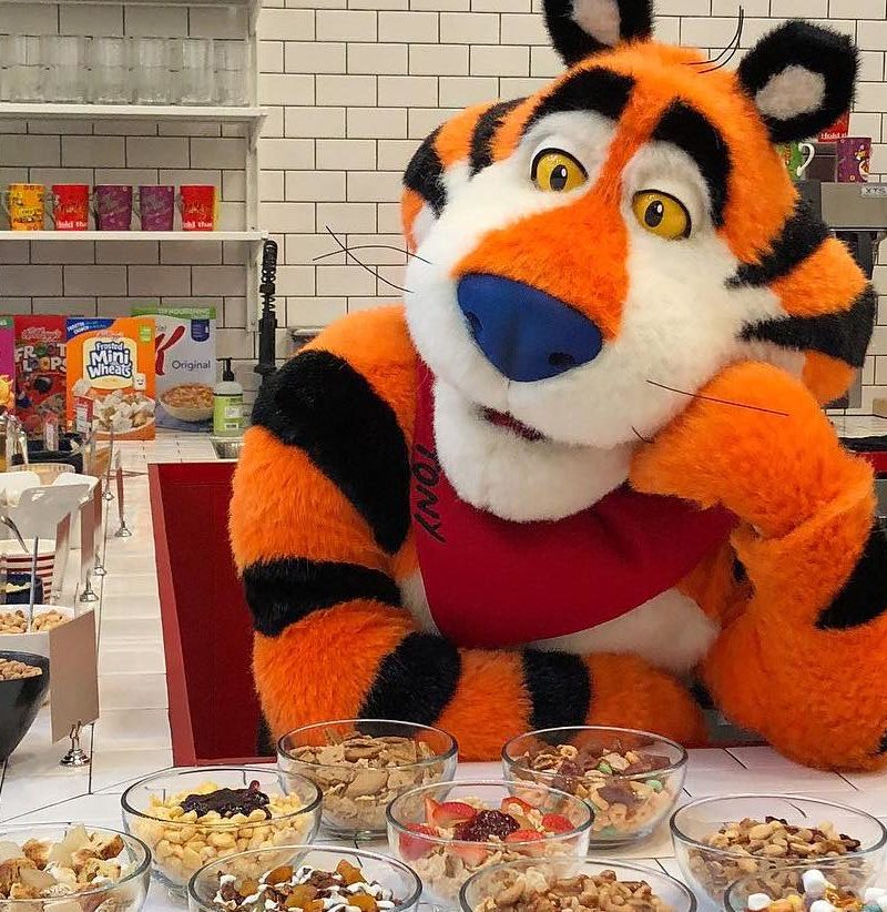 A person dressed as Tony the Tiger in Kellog's new New York City cafe. - Kellog's / <a href='https://www.instagram.com/kelloggsnyc/'>Instagram</a>