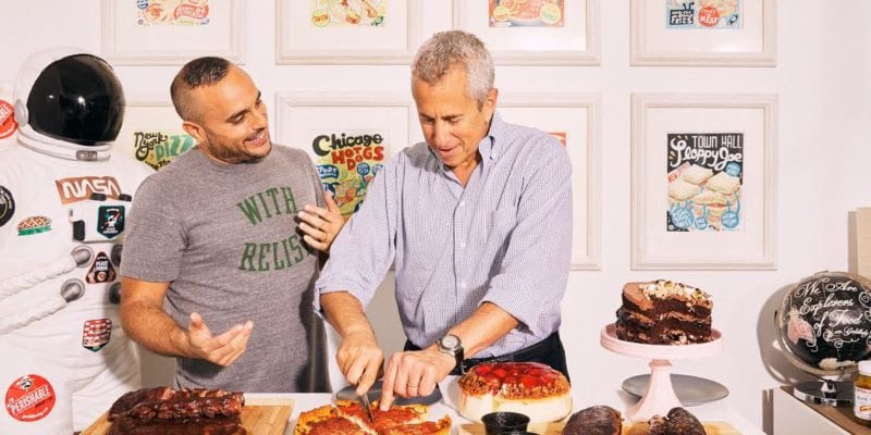 GoldBelly has announced a $20 million investment led by Danny Meyer's Enlightened Hospitality Investments. Pictured here, Meyer cuts into one of Chicago's famous crusted casseroles. / Goldbelly
