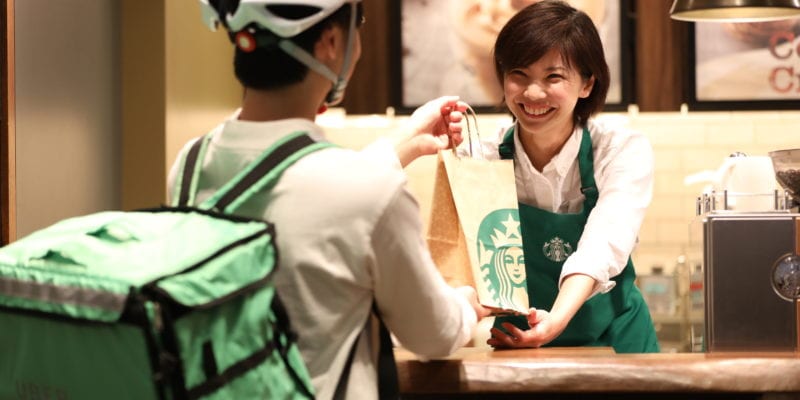 Starbucks' pilot program with Uber Eats will begin in six stores - located in Tokyo, Shinjuku and Roppongi - with plans to scale in the next two years. / Starbucks