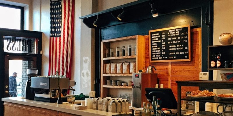 Press Coffe Bar in Dayton, Ohio. The stage is one of 29 that have a higher minimum wage than the federal standard. - Ian Baldwin / <a href='https://unsplash.com/photos/Dlj-SxxTlQ0'>Unsplash</a>