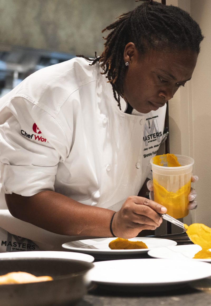 Chef Sherene Hutchinson of Grand Cayman Marriott Beach Resort plates her final dish prior to being named Marriott’s Culinary Master of the Craft. / Marriott International